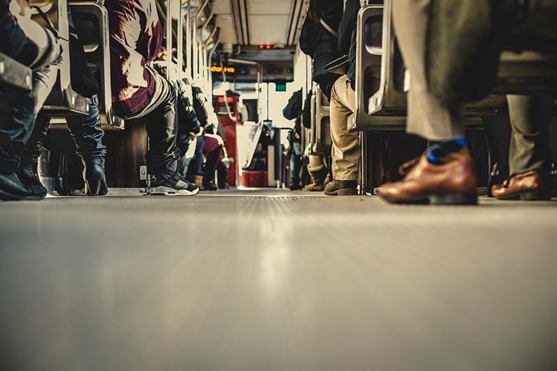 People's feet on a train