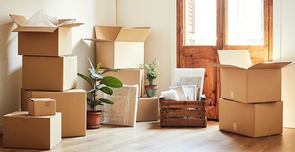 a room with different piles of moving boxes