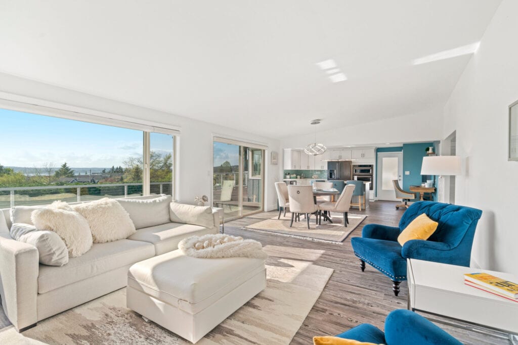 Living room and dining area with area rug.