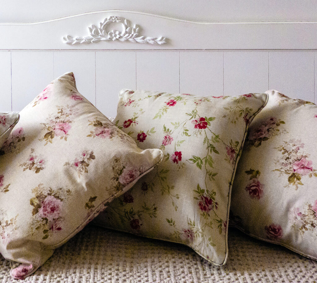A romantic detail of a bed inspired by French style