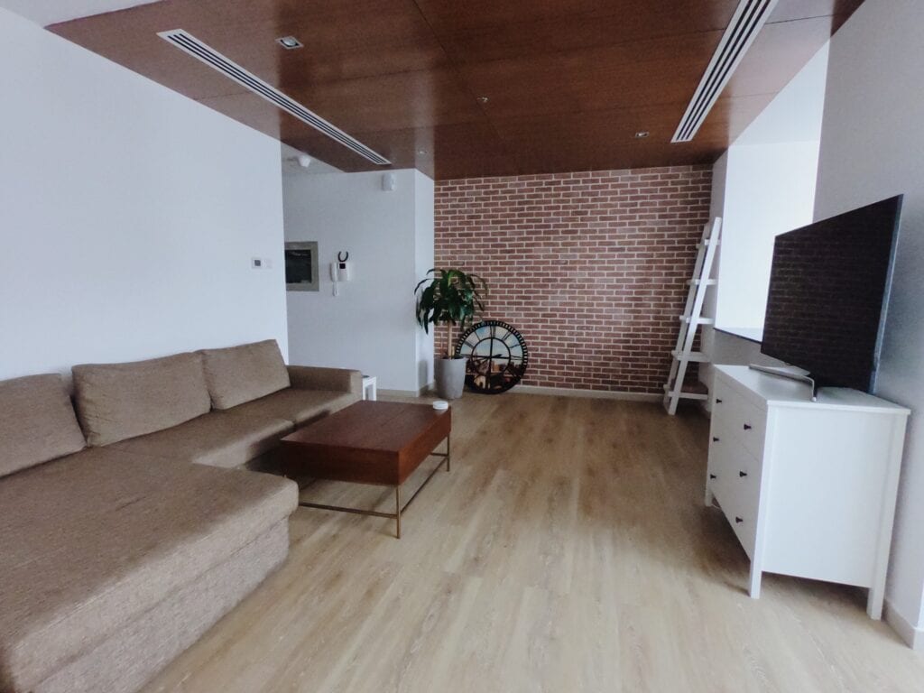 Living room with brick wall