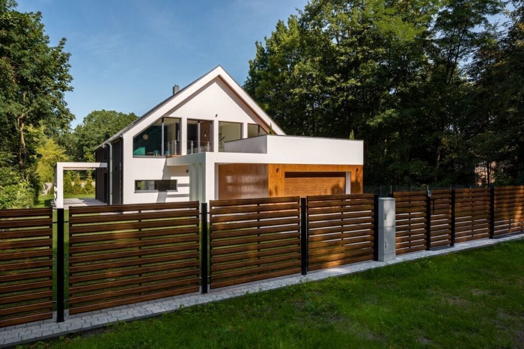 Wood and metal fence outside of modern house