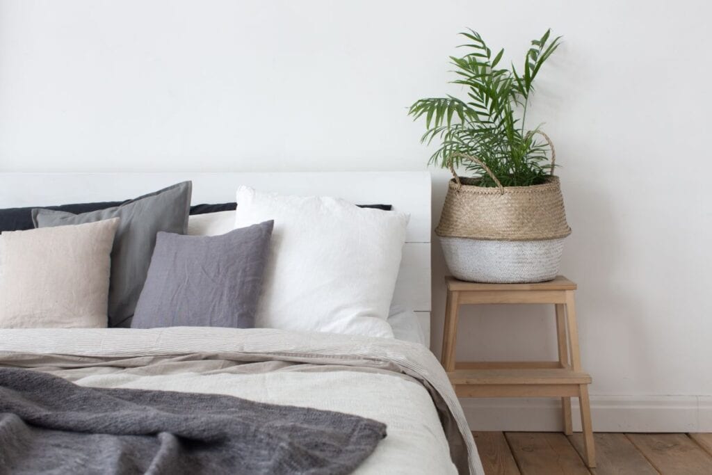 Modern bedroom with stool used for nightstand