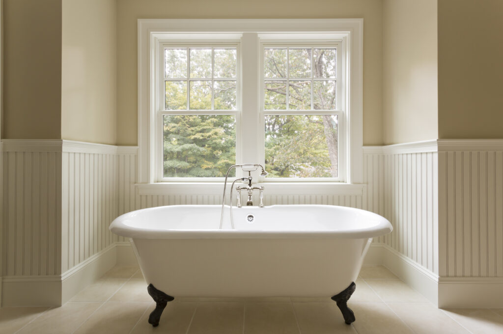 Bathtub in custom designed unfurnished bathroom.