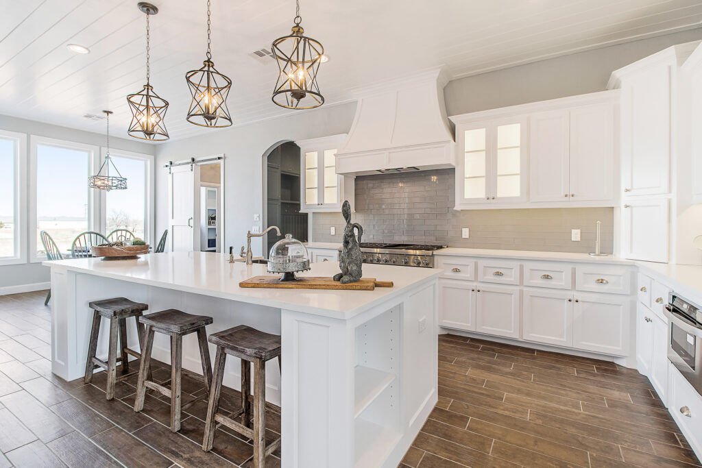 Luxury kitchen interior, farmhouse barstools and rustic light fixtures