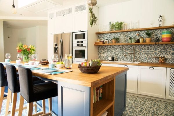 Mediterranean style kithcen, matching tile backsplash and floors