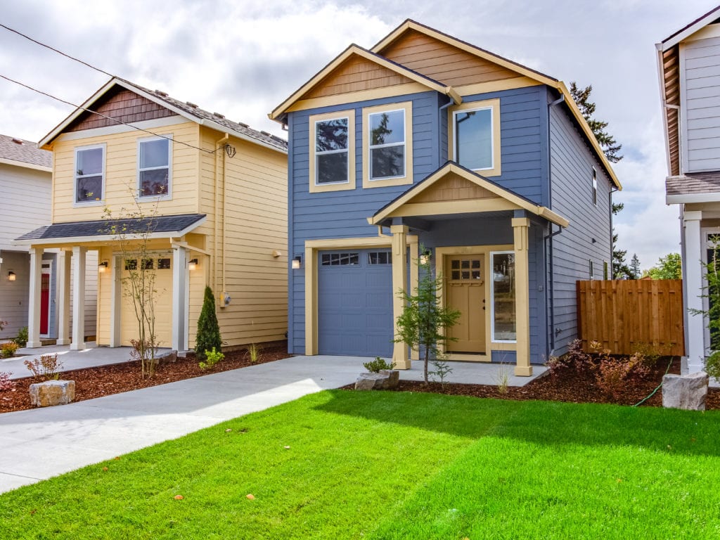 Exterior of new blue and yellow houses