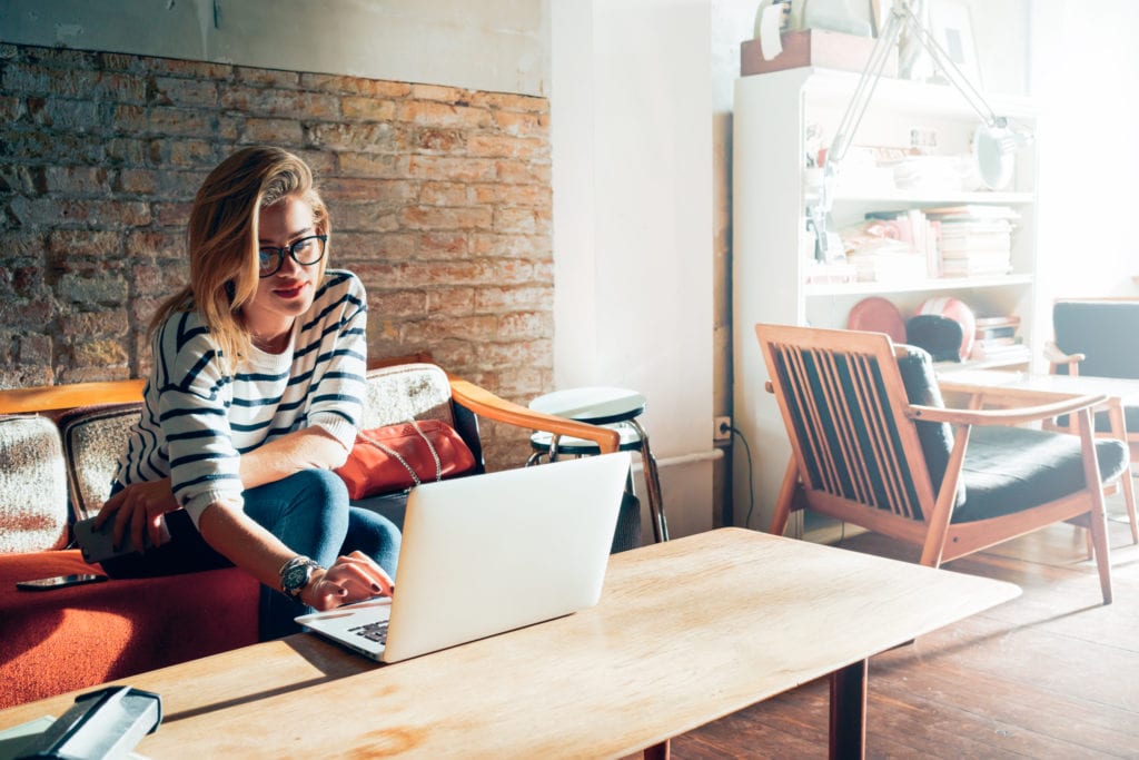 woman using laptop at home