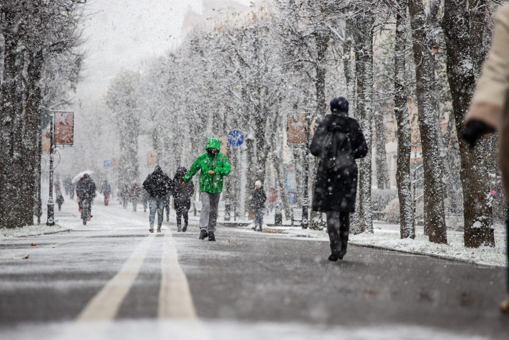 People walking in snowstorm