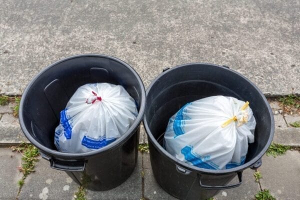 Rubbish bins filled with waste bags, Brussels, Belgium