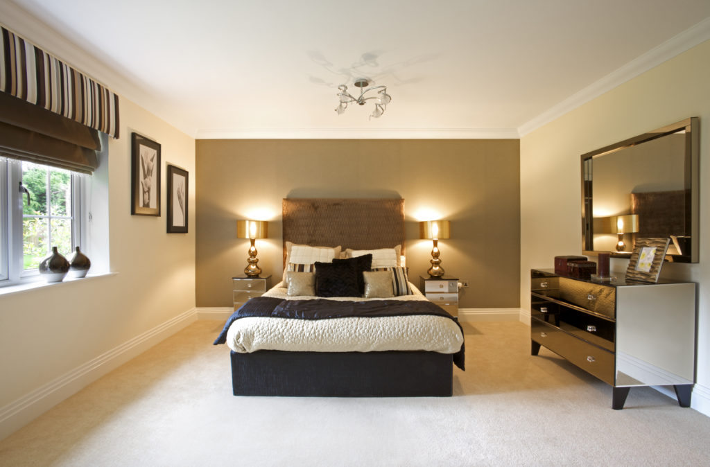 a luxury bedroom from an expensive new home. This has been prepared as the show home by a leading Interior Designer. It could also represent a luxury hotel room. Bright and spacious, this room depicts space and comfortable living.
