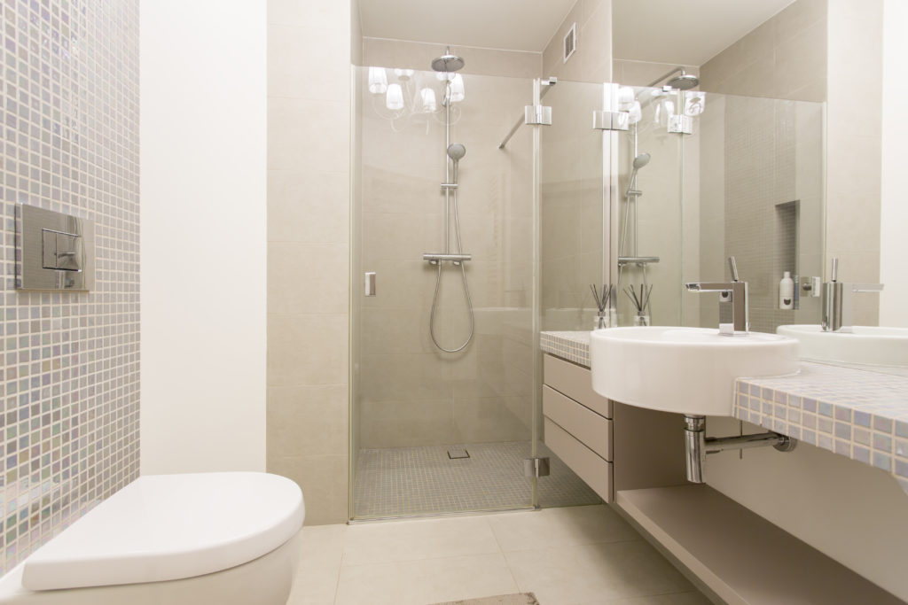 Bathroom with beige walls and cabinets