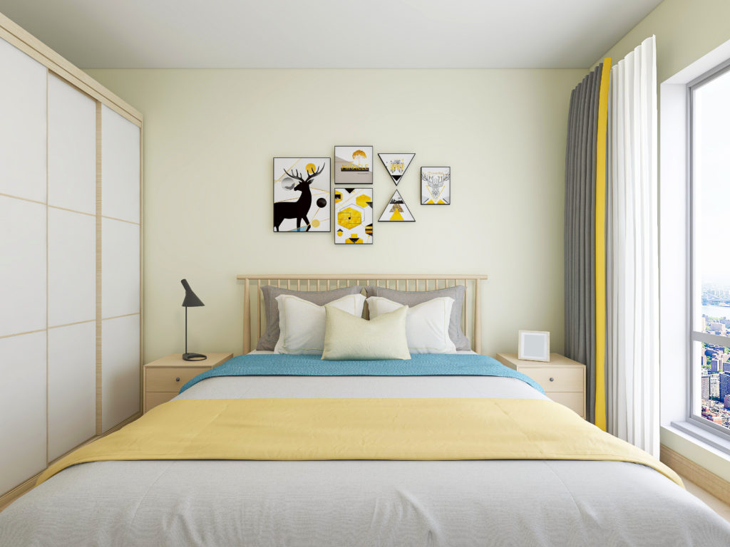 Light yellow bedroom with yellow and blue accents