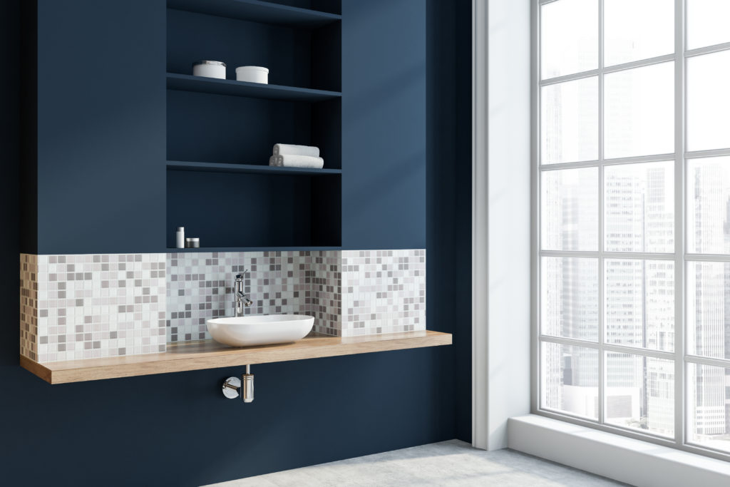 Navy blue bathroom with floor to ceiling windows