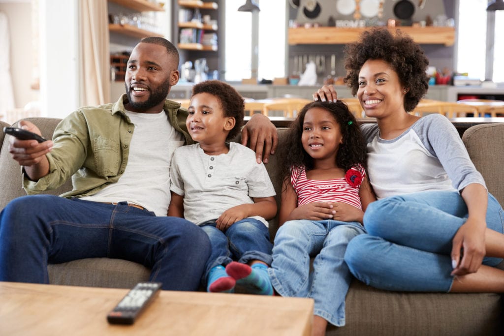 Family sits down to watch TV