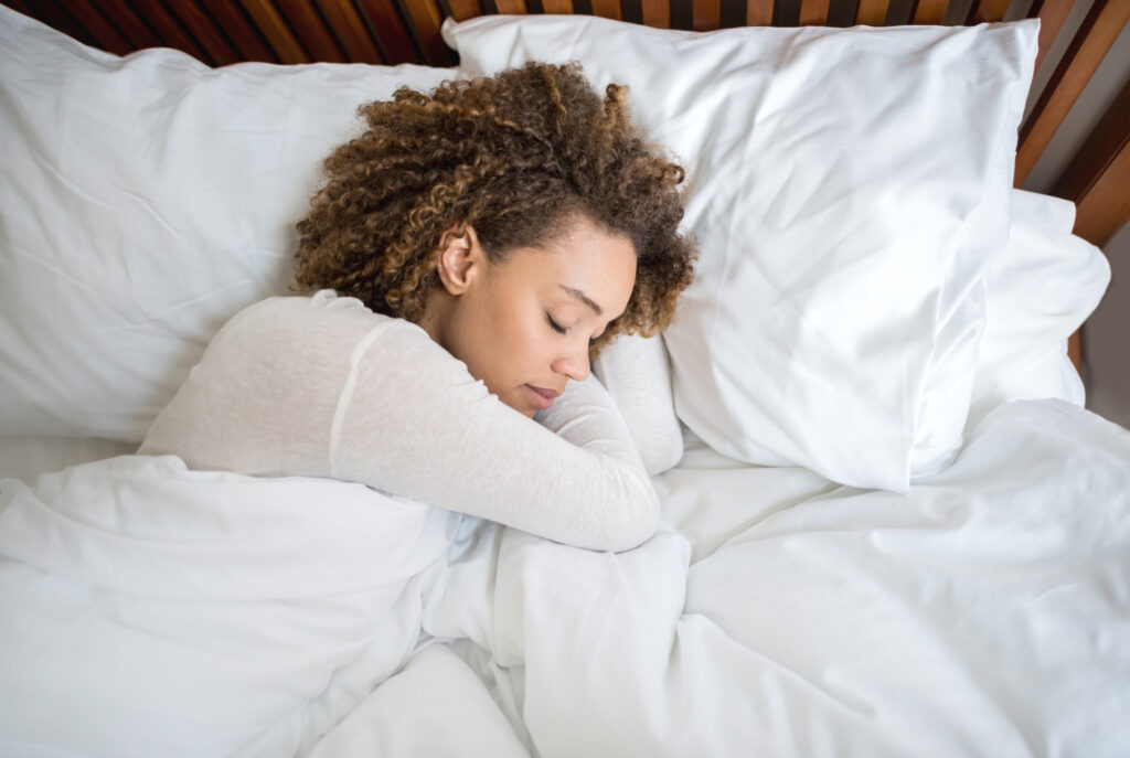 woman comfortably sleeping on her new mattress