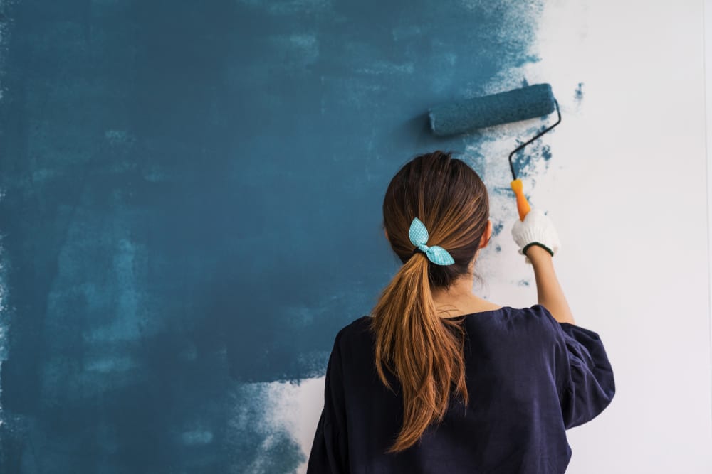 woman painting wall