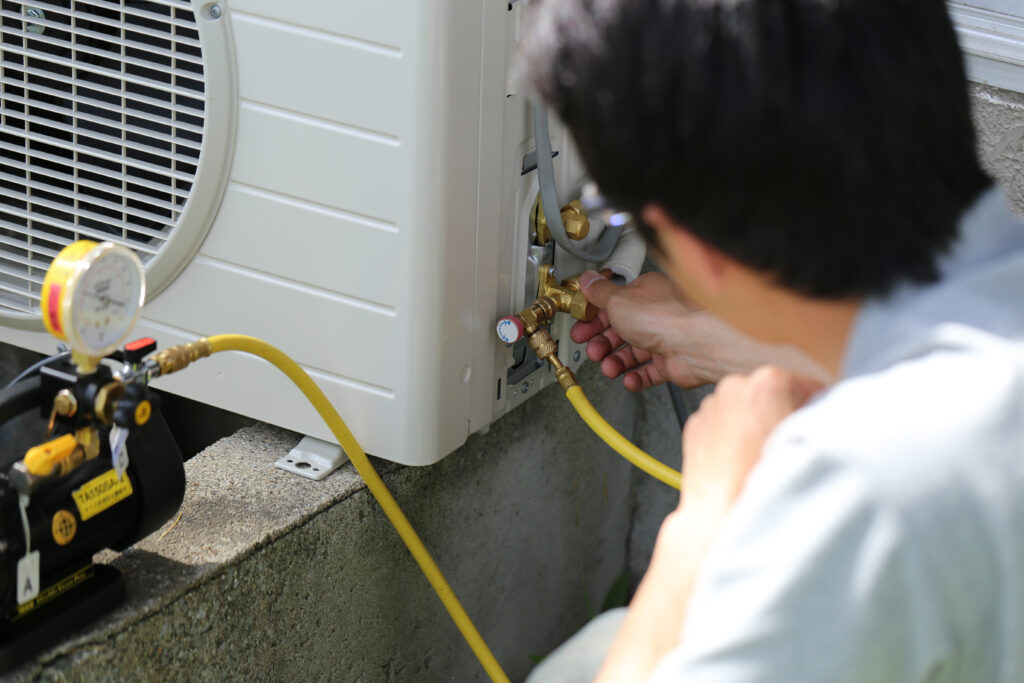 Man repairing AC unit