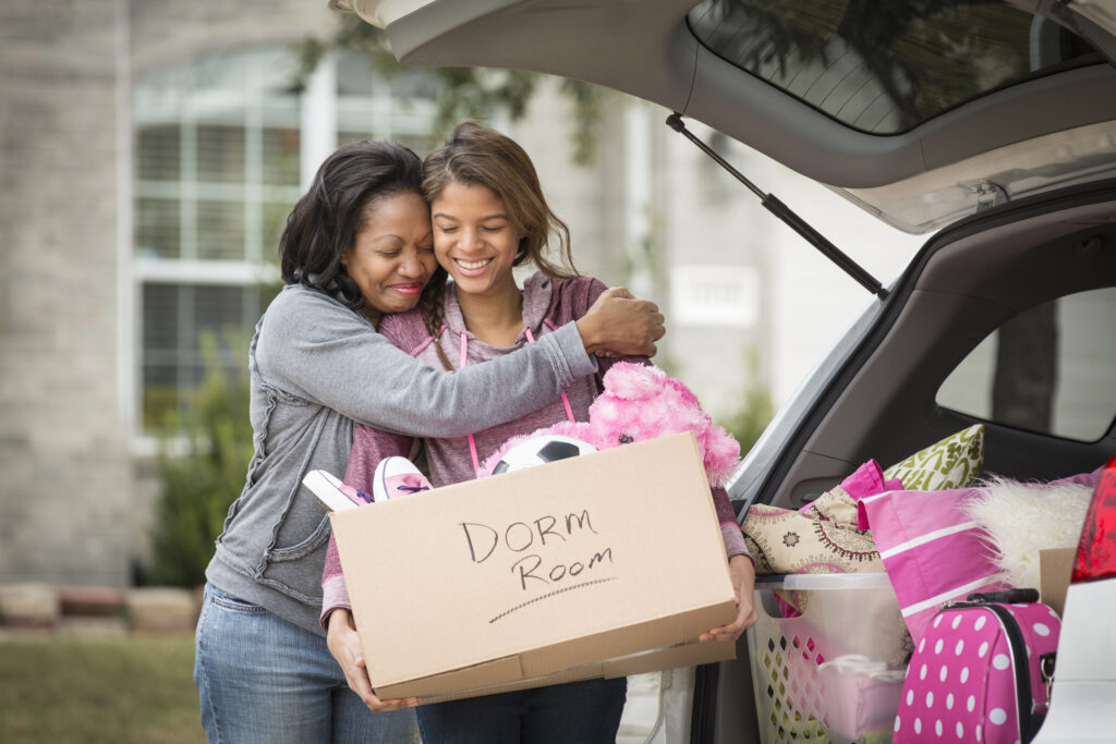 Mother hugging daughter going off to college