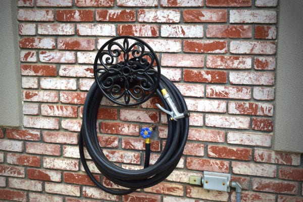 Black hose with decorative hose holder