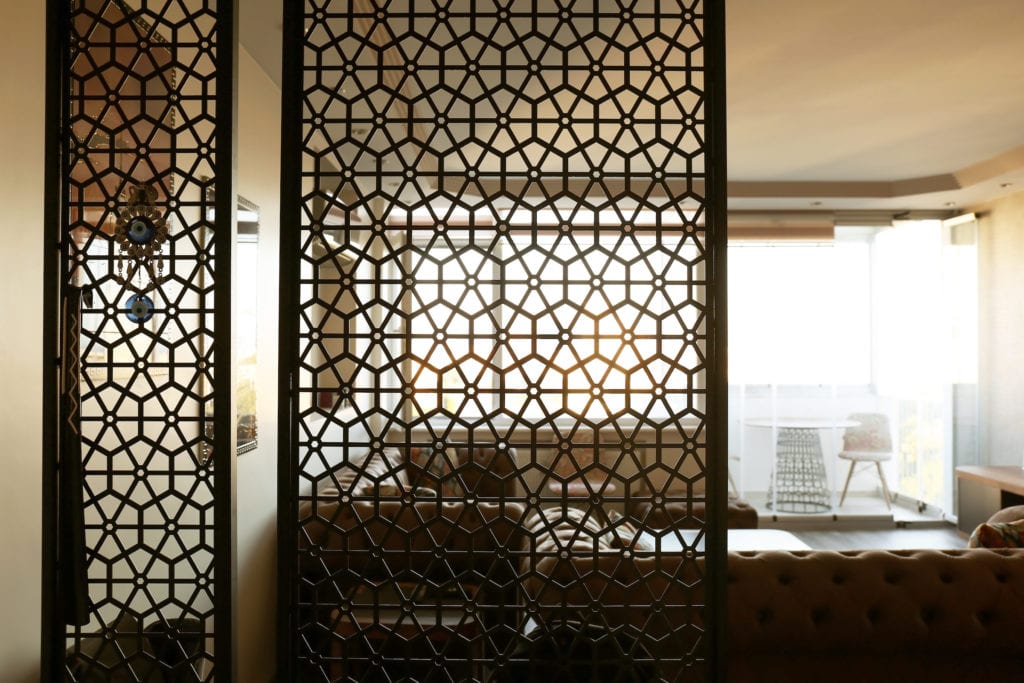 Interior of living room, view through decorative room divider