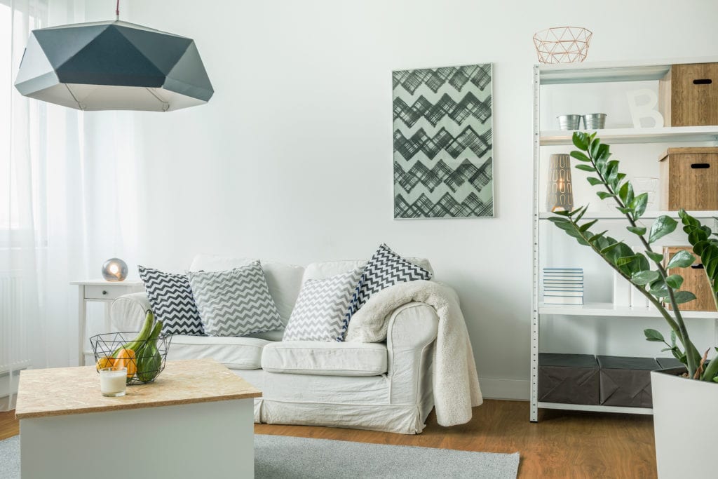 Very bright living room with white furniture