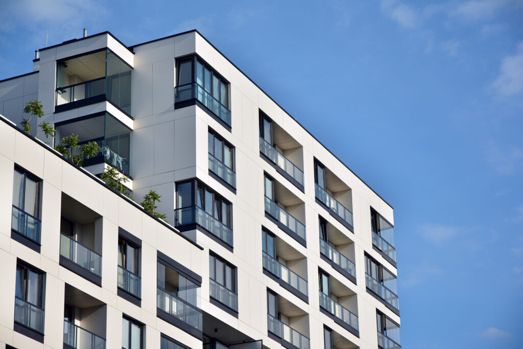 View of a white and black modern condo building