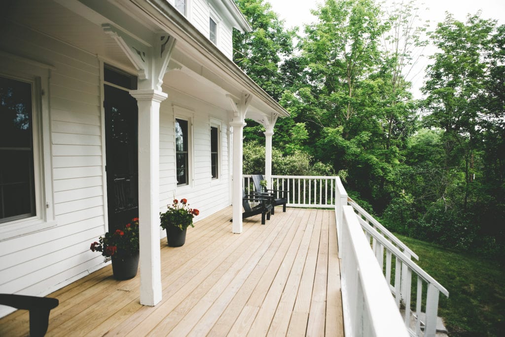 White exterior house with large spacious patio