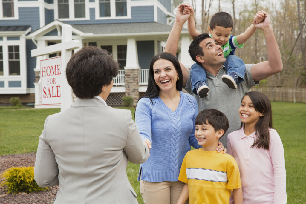 Realtor welcomes a young family into their new home