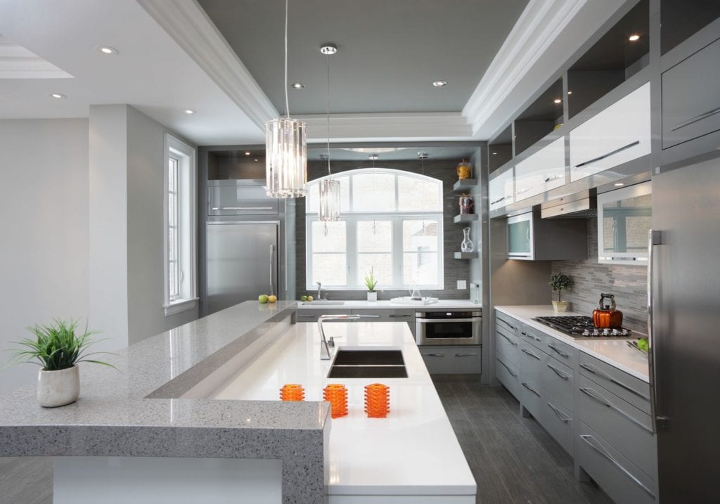 Shades of gray in the cabinets, backsplash, countertops, ceiling, and floors. 