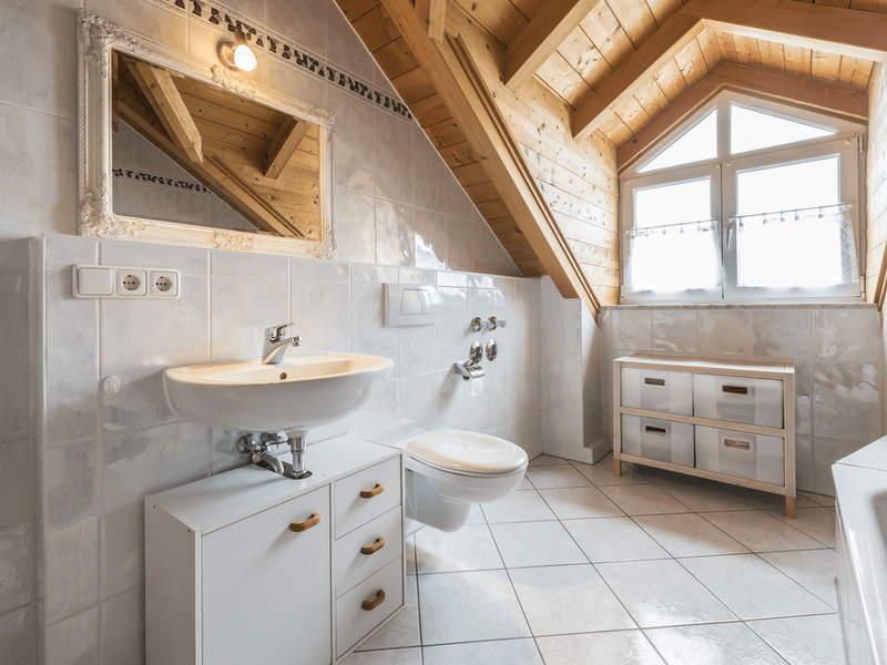 Attic bathroom with wood accents