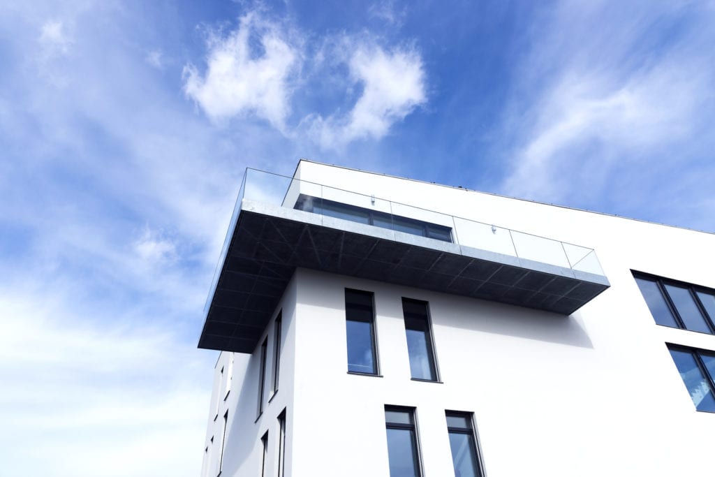 White house or apartment building with modern balcony