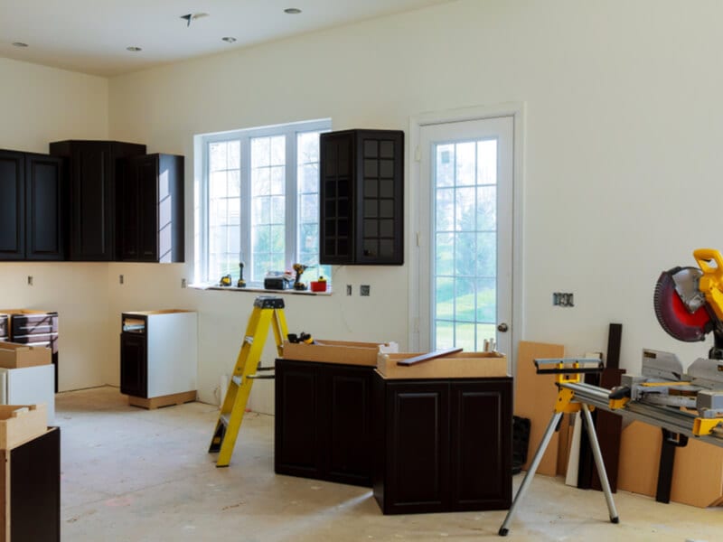 Kitchen cabinets being installed