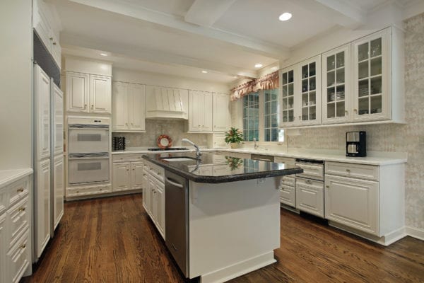 Luxury kitchen with island and cream colored cabinets