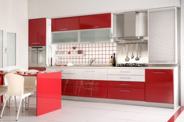 Kitchen with red cabinets and accents