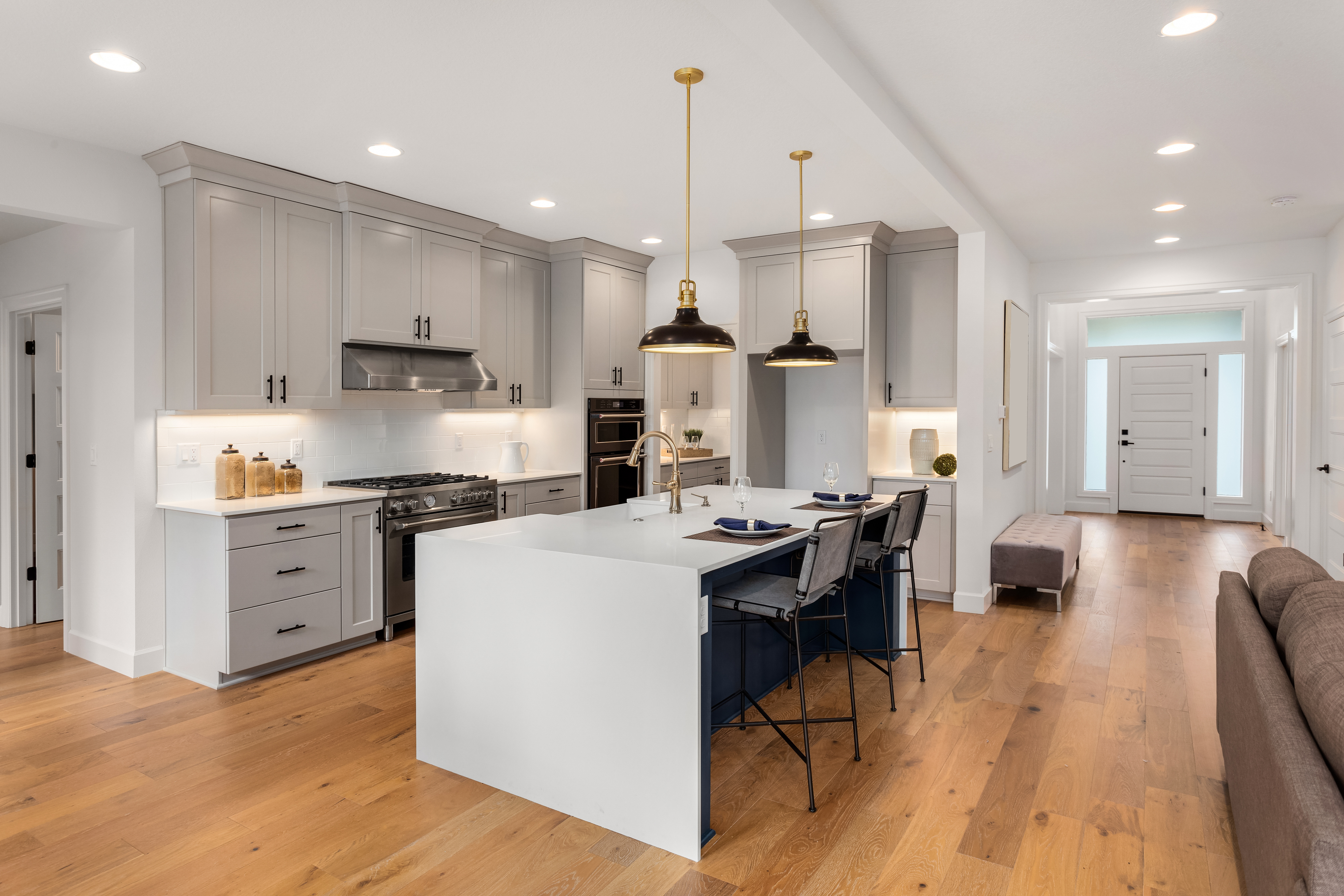 Luxury kitchen with hardwood floors and greige cabinets