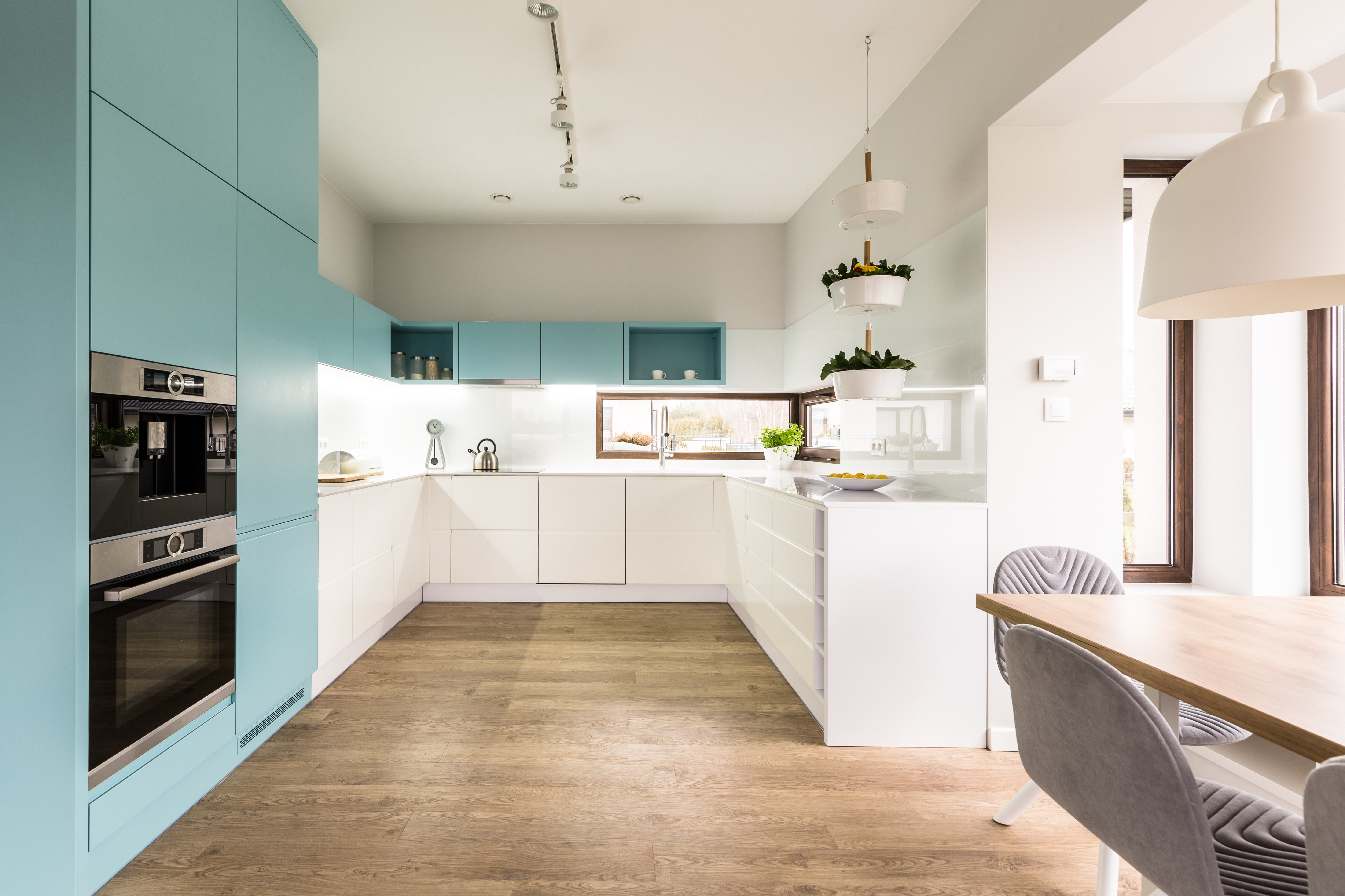 Kitchen with white and blue cabinets