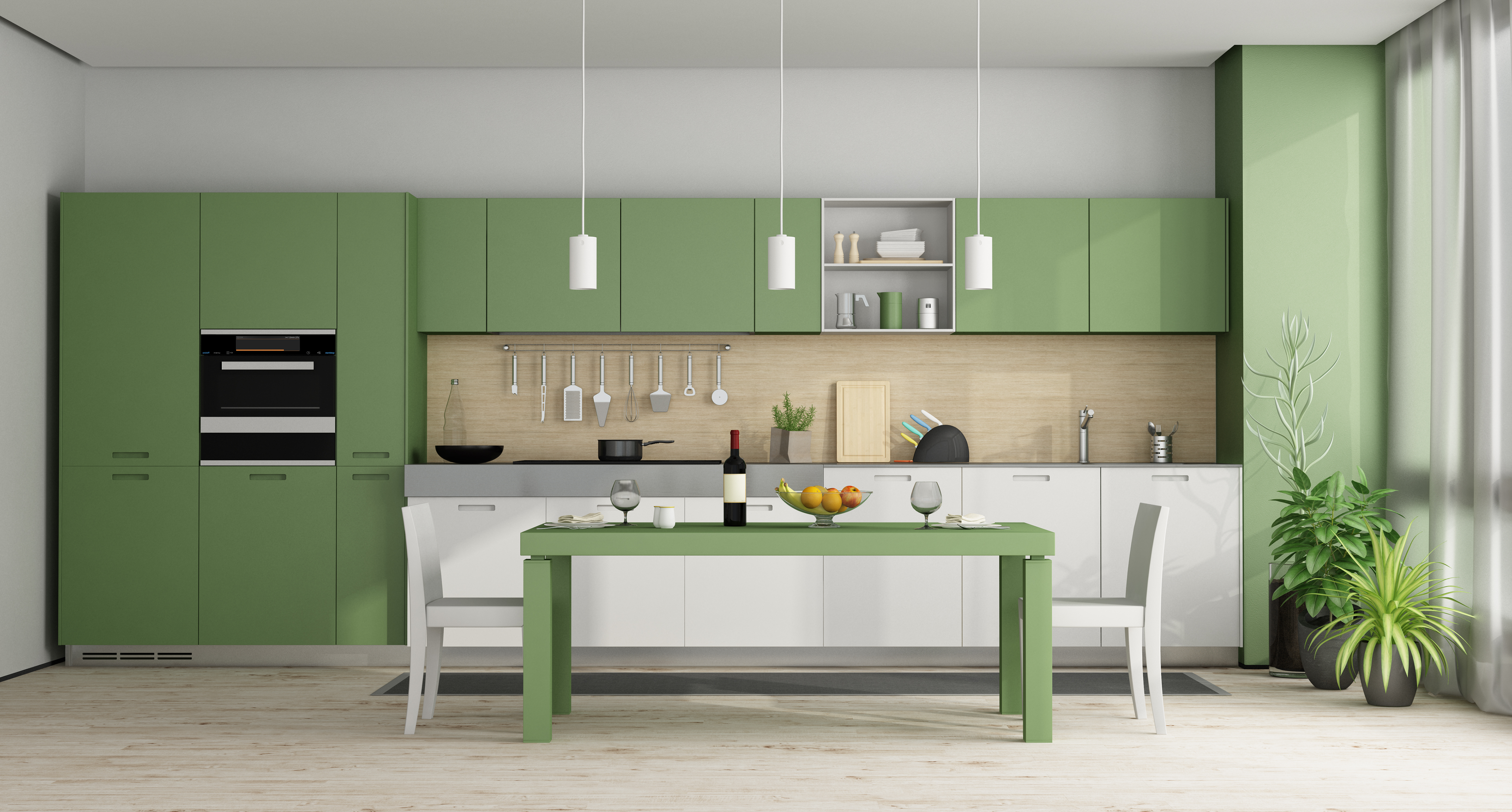 Modern kitchen with green cabinets and dining table