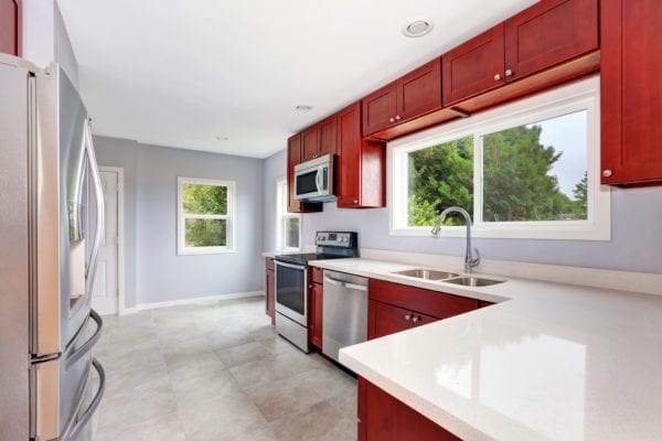 Kitchen with wine red wooden cabinets