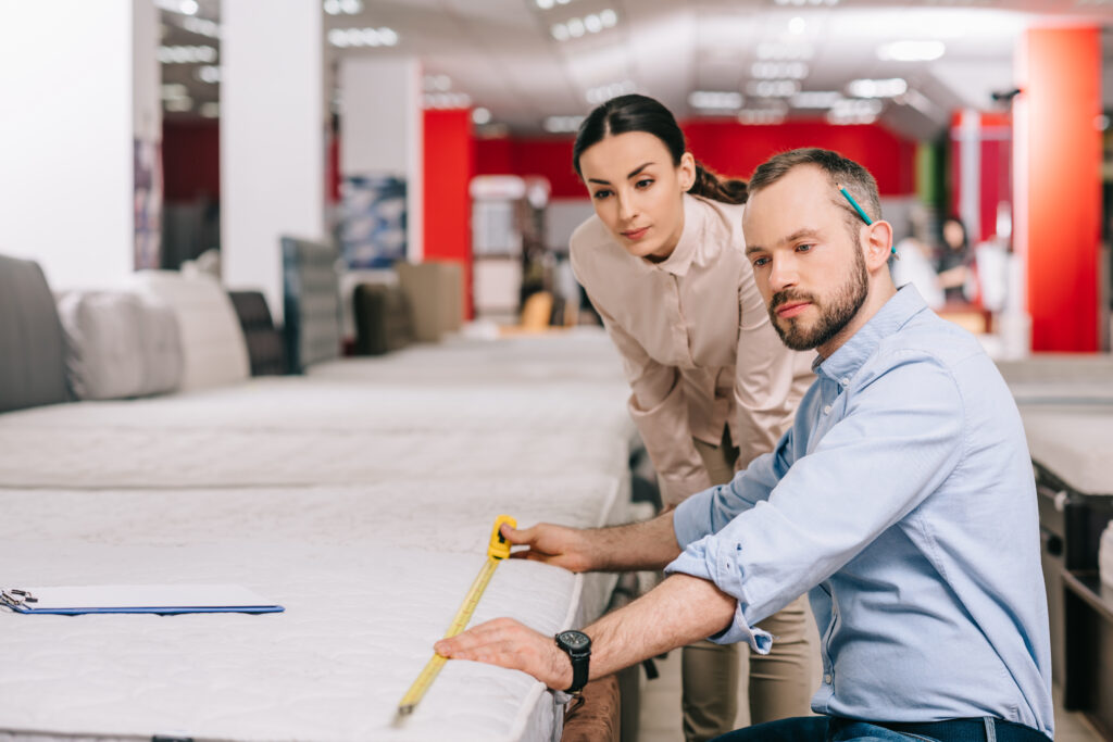 couple buying a mattress