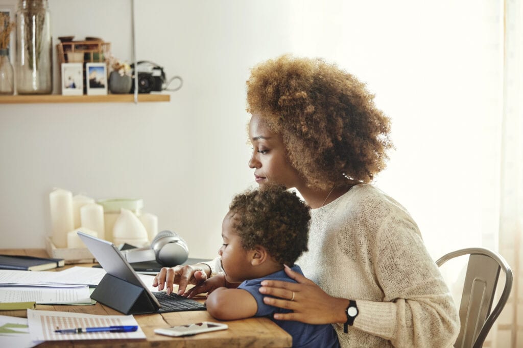 black woman and her son at the computer