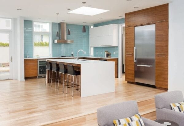 Kitchen with light blue tile backsplash