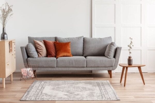 Modern gray sofa with colorful throw pillows