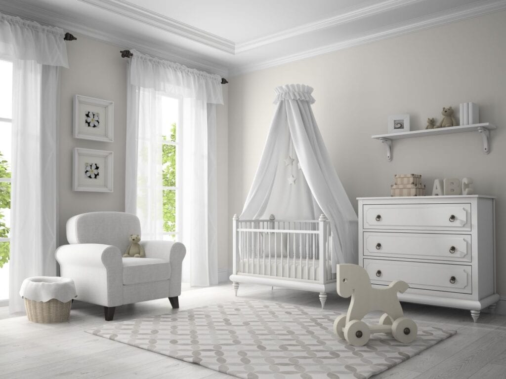Neutral colored nursery with white furniture and greige walls
