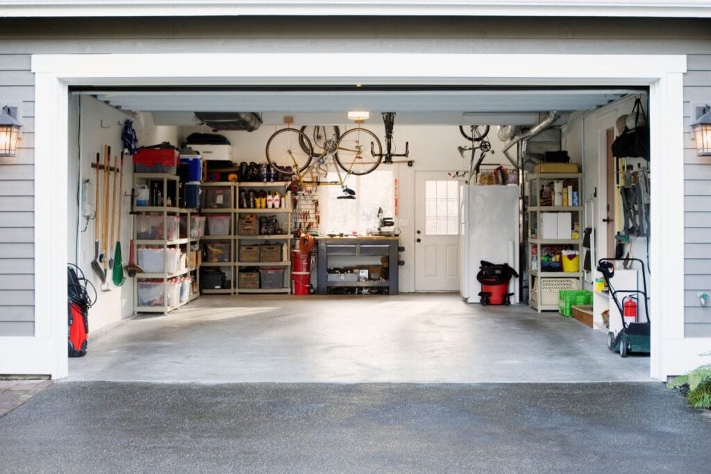 Organized garage with a lot of storage, bikes stored overhead