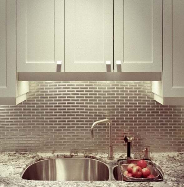 Metallic, stainless steel-style tile backsplash