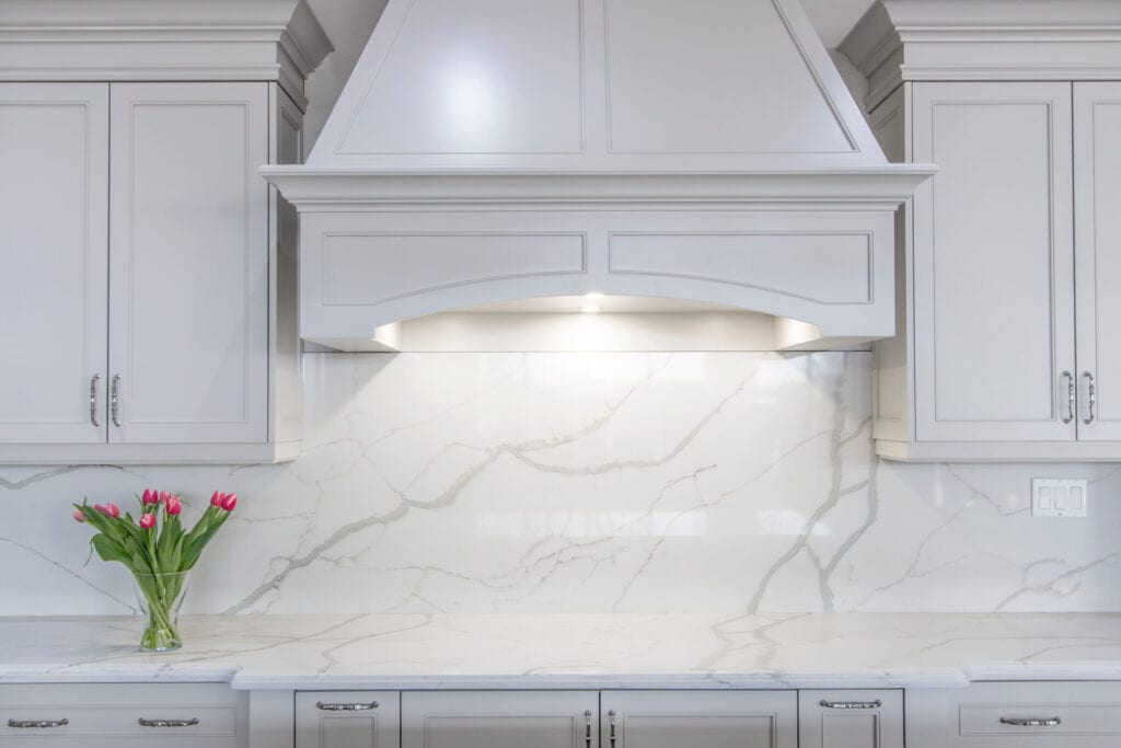 Traditional kitchen with white marble backsplash