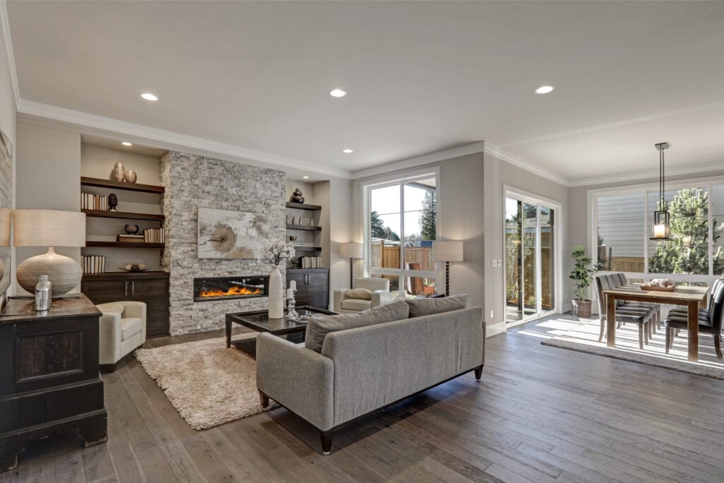 Greige home with open floorplan, view of living room and dining room