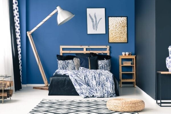 Blue teen bedroom with bold accent wall