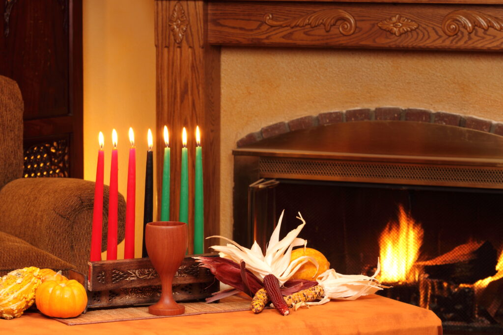 Kwanzaa Candles By Fireplace Left Horizontal